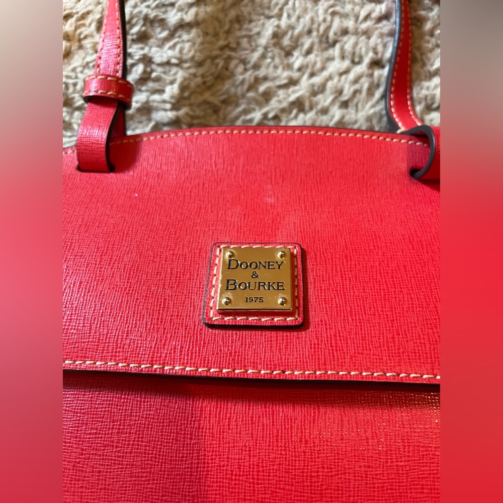 Dooney & Bourke Crossbody Bag. Rarely used. Leather still stiff, not broken in.